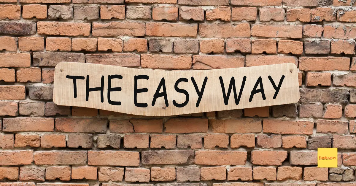 The easy way sign against a brick wall - 5 Reasons to Use a Mortgage Broker Instead of Going Direct to a Lender