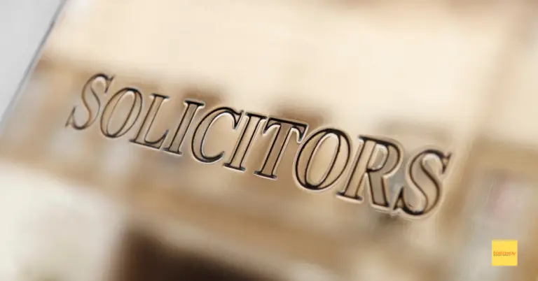 a brass solicitors door sign